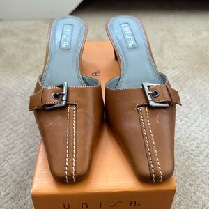 Unisa opened back high heel shoes.